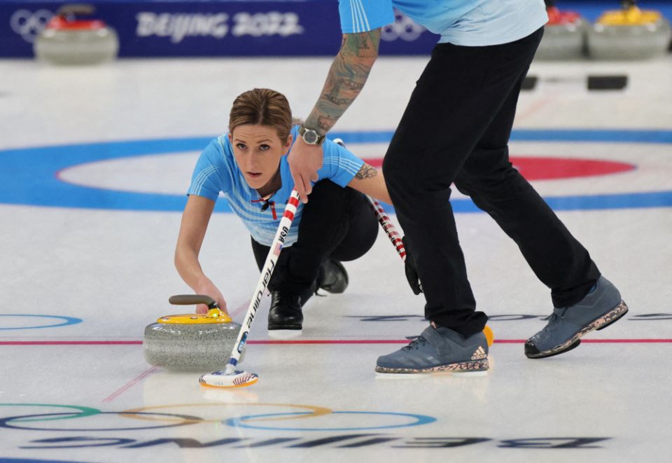 Christopher Plys and Victoria Persinger of the United States are pictured in action during a curling mixed doubles round robin session at the Aquatics Center ahead of the Beijing 2022 Winter Olympics Feb. 2, 2022. (CNS/Rueters/Evelyn Hockstein)