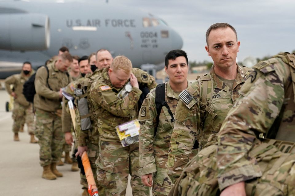 Military personnel from the 82nd Airborne Division and 18th Airborne Corps in Fort Bragg, N.C., board a C-17 transport plane for deployment to Eastern Europe Feb. 3, 2022, amid escalating tensions between Ukraine and Russia. (CNS photo/Bryan Woolston, Reu