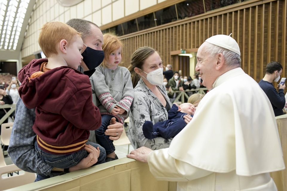 Pope Francis greets family members during his general audience in the Paul VI hall at the Vatican Feb. 9, 2022. (CNS photo/Vatican Media)