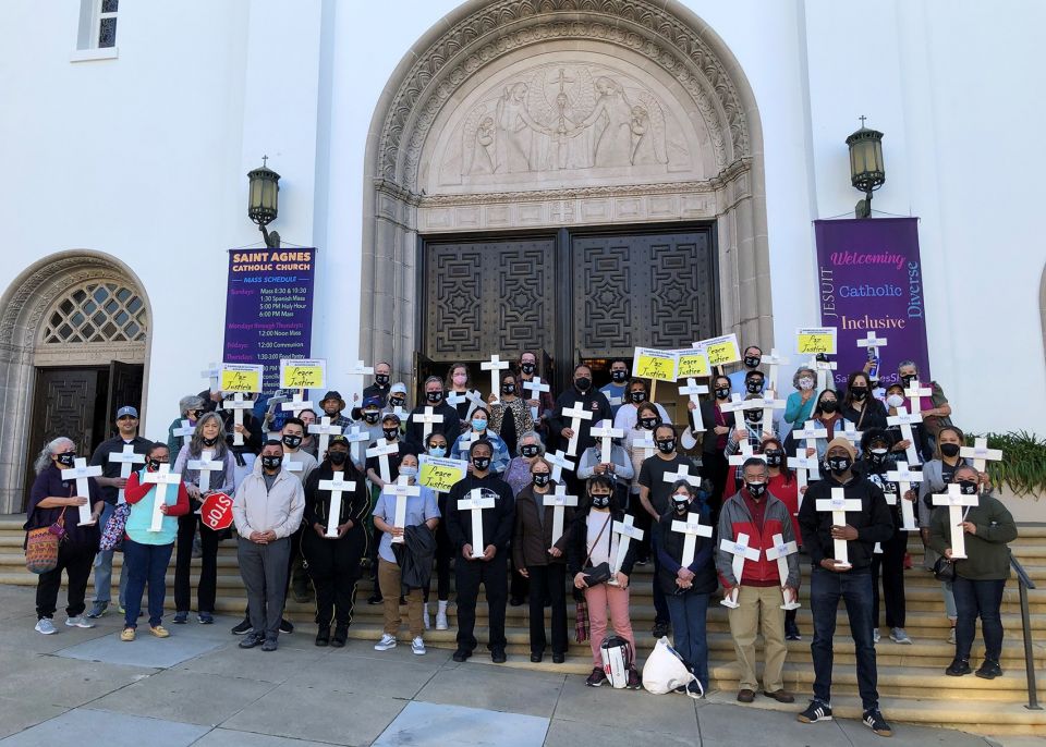 "Walk for Peace" volunteers, parishioners and community members gather before Mass at St. Agnes Church in San Francisco Feb. 5, 2022.  (CNS photo/Melissa Vlach, Archdiocese of San Francisco Office of Human Life & Dignity)