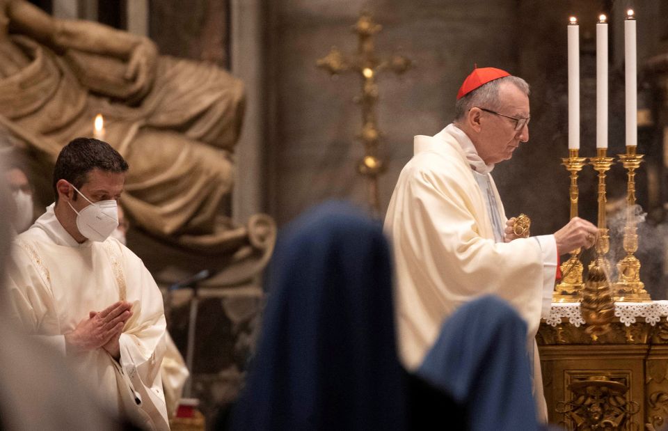 Cardinal Pietro Parolin, Vatican secretary of state, spreads incense during Mass in St. Peter's Basilica at the Vatican Jan. 1, 2021. (CNS photo/Alessandra Tarantino, pool via Reuters)