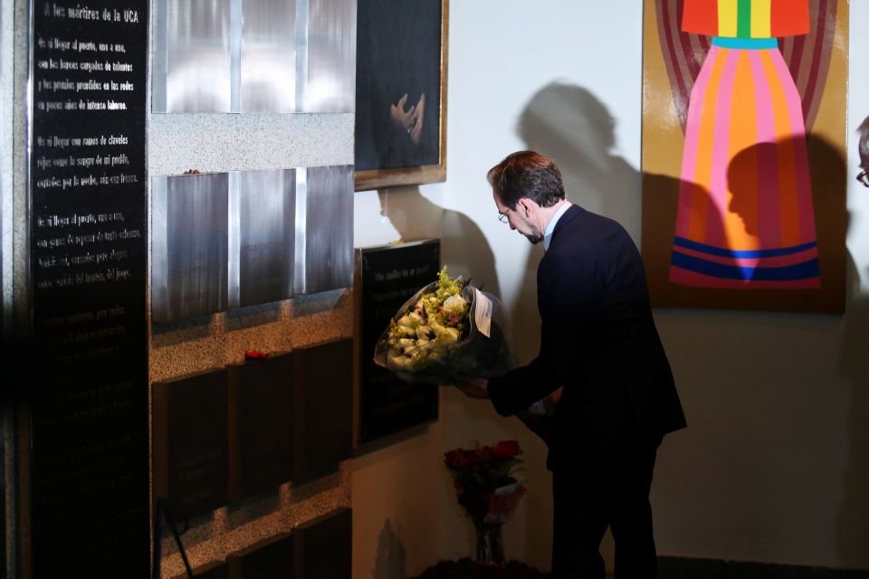 U.N. High Commissioner for Human Rights Zeid Ra'ad Al Hussein places flowers beneath plaques commemorating the six Jesuit priests and two employees killed in 1989, at the Central American University in San Salvador, El Salvador, Nov. 16, 2017. (CNS photo/