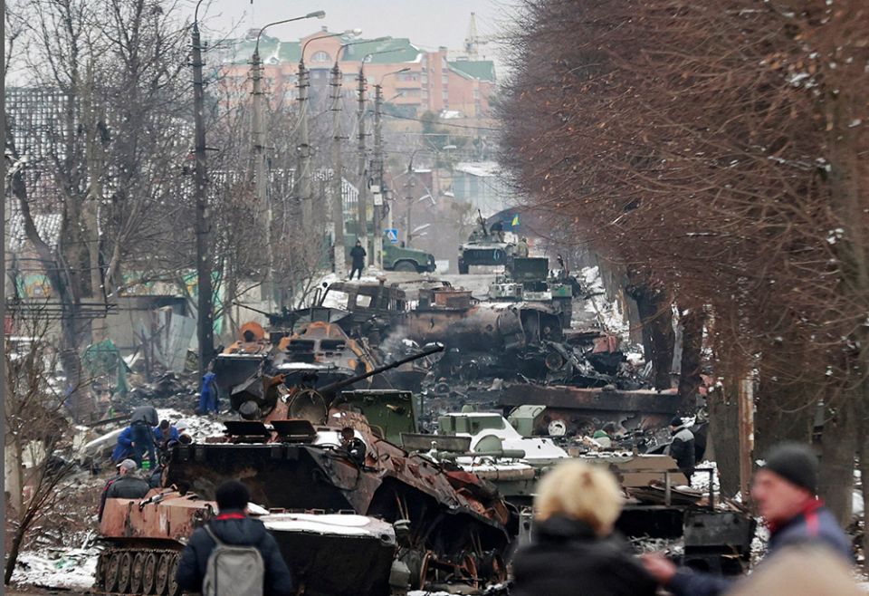 Destroyed military vehicles are seen on a street March 1 in Bucha, Ukraine, as Russia's invasion of Ukraine continues. (CNS/Reuters/Serhii Nuzhnenko)