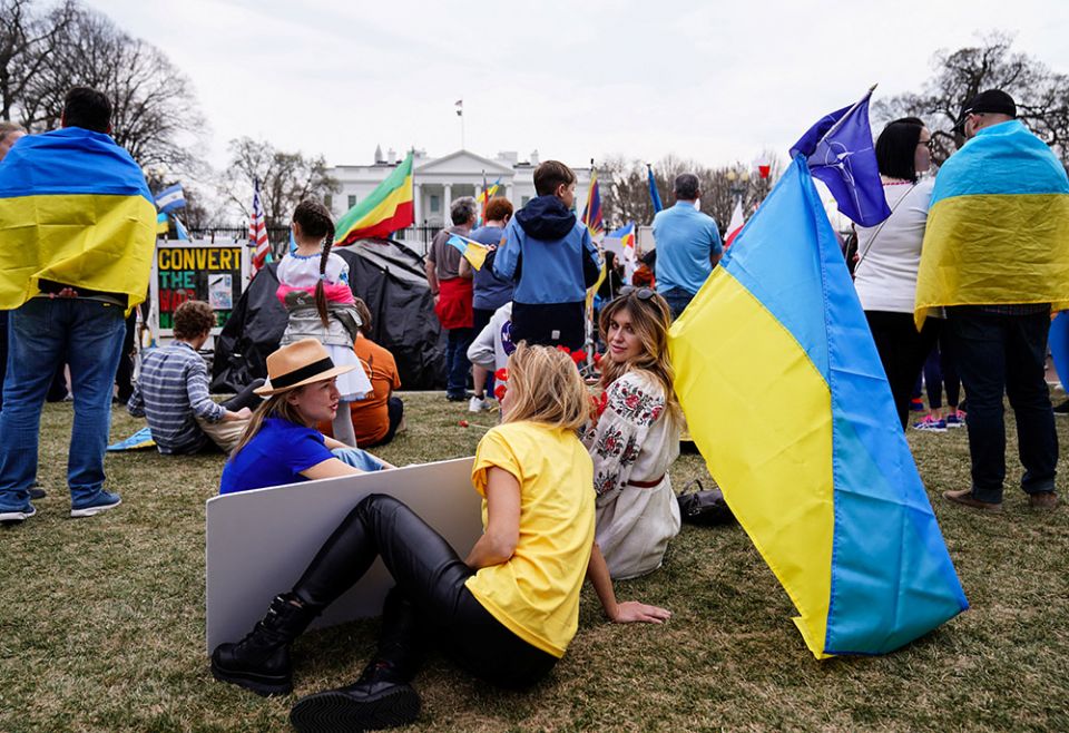 People near the White House in Washington gather for a protest March 6, against Russia's invasion of Ukraine. (CNS/Reuters/Sarah Silbiger)