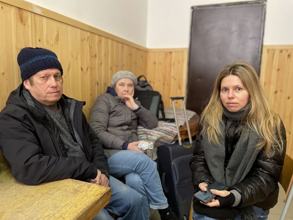Oleg and Valentina Malakhivska are pictured with their daughter, Iuliia, at a refugee center in Barabás, Hungary, March 11, 2022. (CNS photo/Junno Arocho Esteves)