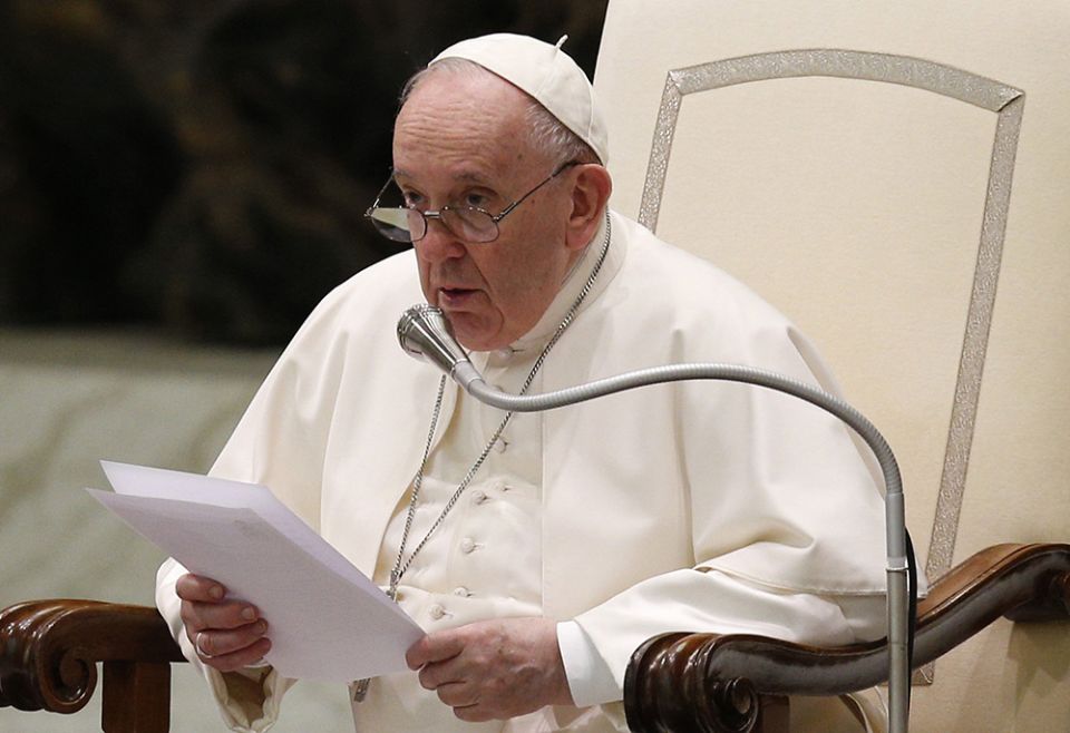 Pope Francis recites a prayer, "Forgive us for the war, Lord," composed by Italian Archbishop Domenico Battaglia of Naples, during his general audience in the Paul VI hall March 16 at the Vatican. (CNS/Paul Haring)
