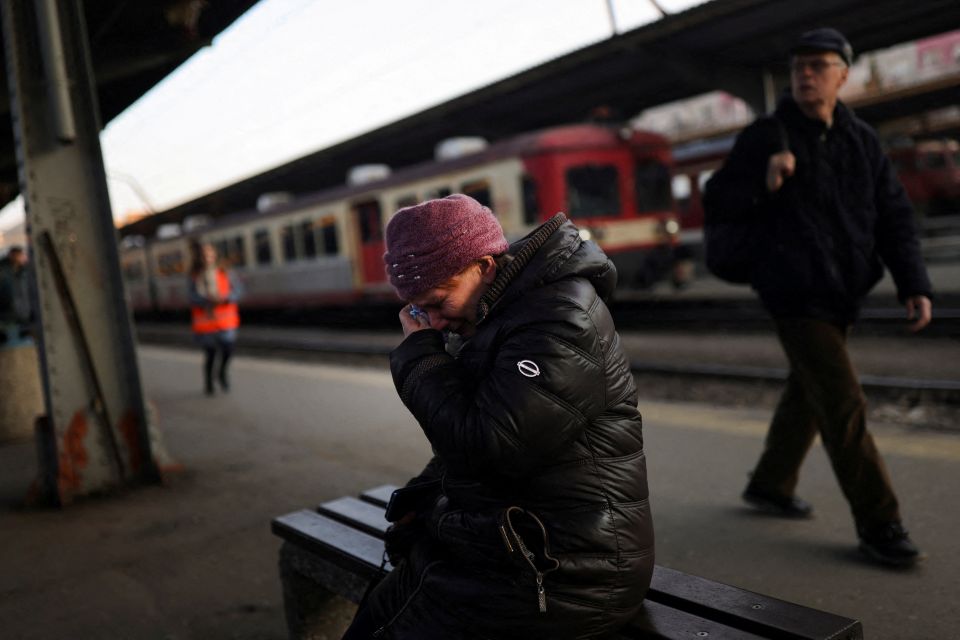 A Ukrainian refugee at North Railway Station in Bucharest, Romania, cries as she says goodbye to a family member March 14, 2022, following the Russian invasion of Ukraine. (CNS photo/Edgard Garrido, Reuters)