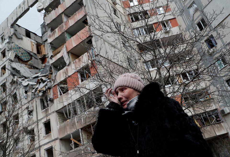 A woman reacts in front of destroyed apartment buildings March 17 in Mariupol, Ukraine. (CNS/Reuters/Alexander Ermochenko) A woman reacts in front of destroyed apartment buildings March 17 in Mariupol, Ukraine. (CNS/Reuters/Alexander Ermochenko)