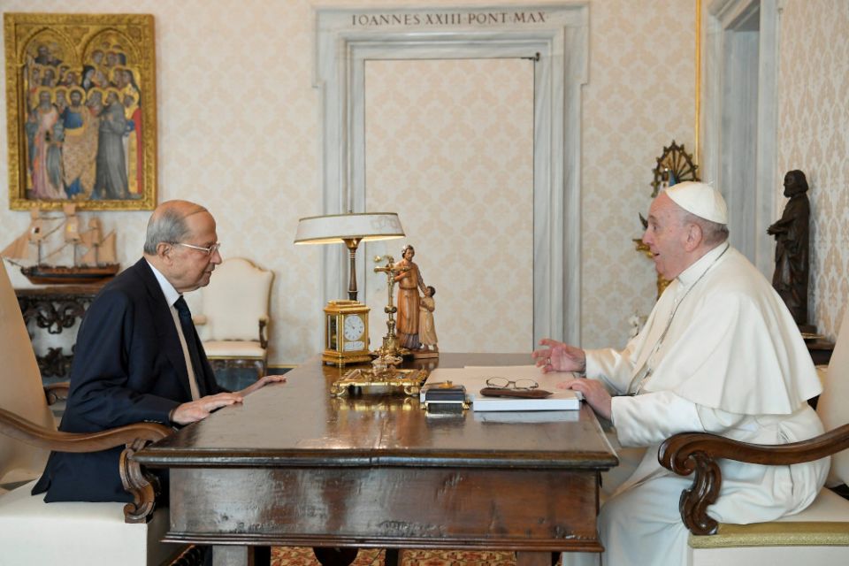 Pope Francis speaks with Lebanese President Michel Aoun during a private meeting at the Vatican March 21, 2022. Aoun tweeted April 5 that the nuncio has informed him Pope Francis is looking to visit the country in June. (CNS/Vatican Media via Reuters)