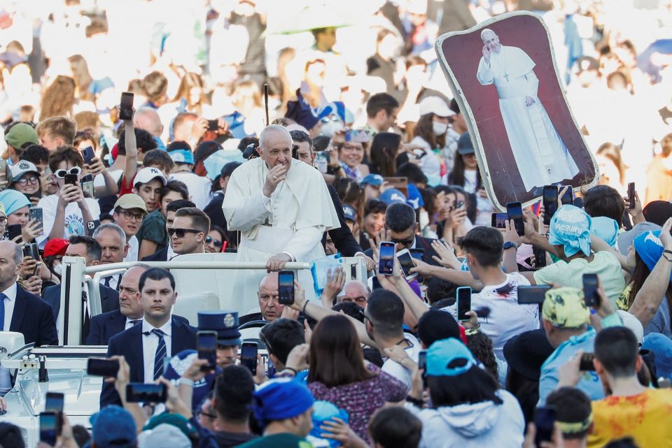 Pope Francis waves as he arrives for a meeting with thousands of young people taking part in a pilgrimage organized by the Italian bishops' conference in St. Peter's Square at the Vatican April 18, 2022. (CNS photo/Remo Casilli, Reuters)