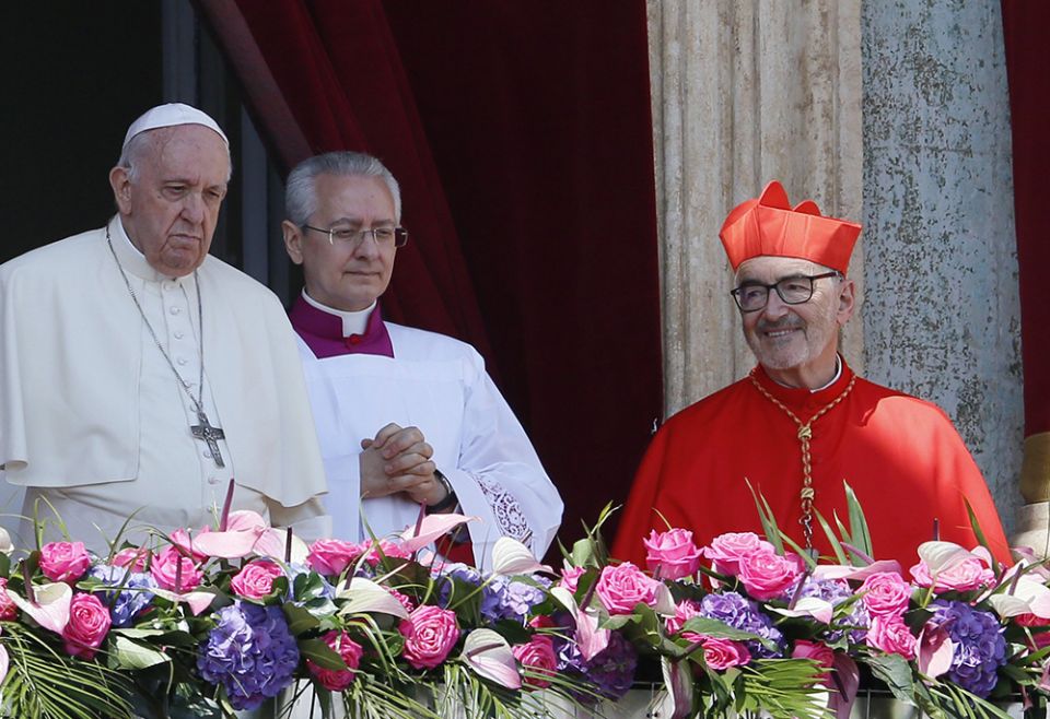 Cardinal Michael Czerny looks on as Pope Francis delivers his Easter message and blessing "urbi et orbi" (to the city and the world) from the central balcony of St. Peter's Basilica at the Vatican April 17. (CNS/Paul Haring) Cardinal Michael Czerny looks on as Pope Francis delivers his Easter message and blessing "urbi et orbi" (to the city and the world) from the central balcony of St. Peter's Basilica at the Vatican April 17. (CNS/Paul Haring)