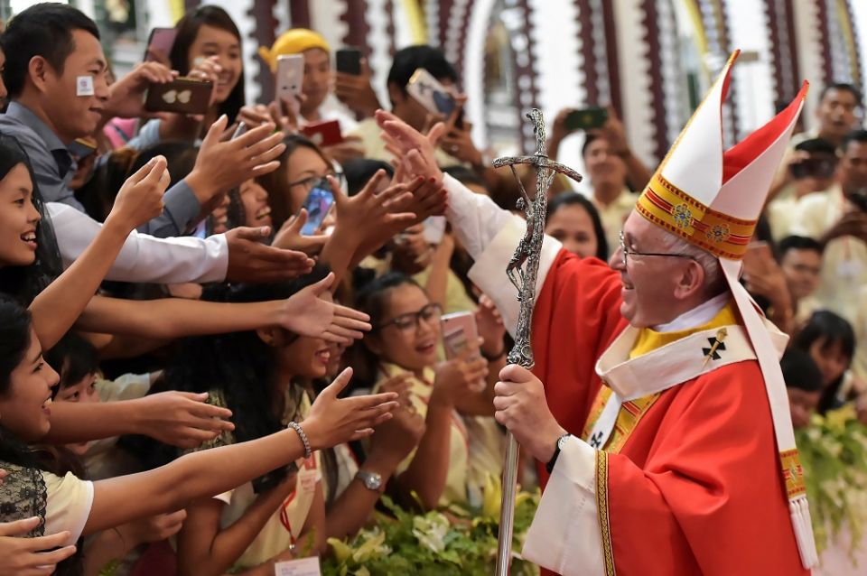 Pope Francis greets young people after celebrating Mass Nov. 30, 2017, at St. Mary's Cathedral in Yangon, Myanmar.