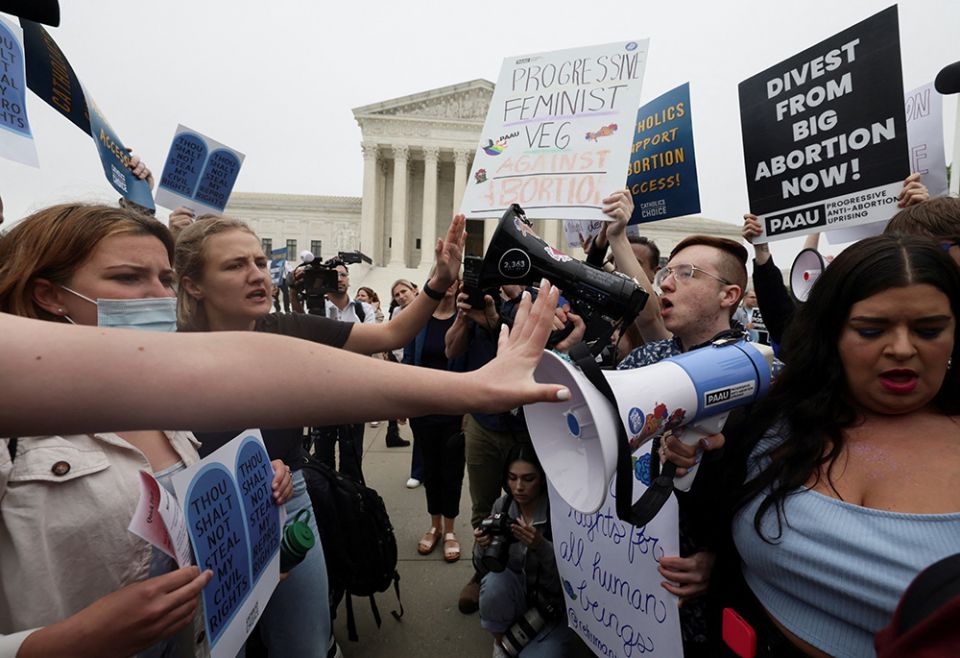 Abortion demonstrators in Washington are seen May 3 outside the U.S. Supreme Court, after the leak of a draft majority opinion written by Justice Samuel Alito preparing for a majority of the court to overturn Roe v. Wade. (CNS) Abortion demonstrators in Washington are seen May 3 outside the U.S. Supreme Court, after the leak of a draft majority opinion written by Justice Samuel Alito preparing for a majority of the court to overturn Roe v. Wade. (CNS)