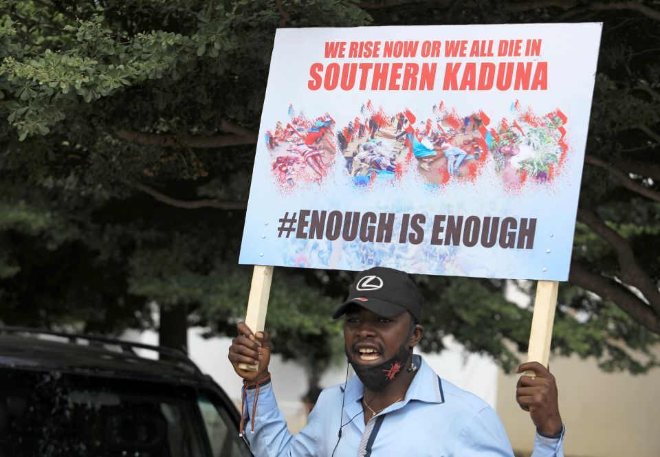 A man holds up a sign against killings in southern Kaduna state and insecurities in Nigeria during a protest in Abuja Aug. 15, 2020. (CNS photo/Afolabi Sotunde, Reuters)
