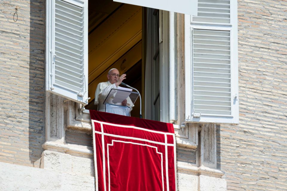 Pope Francis delivers his blessing as he leads the "Regina Coeli" from the window of his studio overlooking St. Peter's Square at the Vatican May 22, 2022. (CNS/Vatican Media)