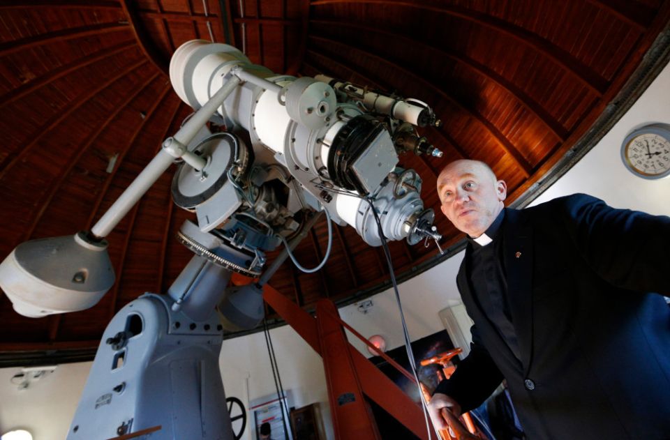 Jesuit Fr. Gabriele Gionti, an astronomer, talks about a 1935 Zeiss telescope during a tour for media representatives of the Vatican Observatory at the papal villa at Castel Gandolfo, Italy, in this Sept. 28, 2018, file photo. (CNS/Paul Haring)