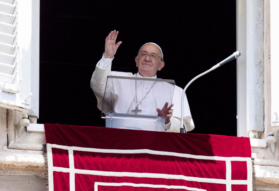 Pope Francis greets the crowd as he leads the Angelus from the window of his studio overlooking St. Peter's Square at the Vatican June 26. (CNS/Vatican Media)