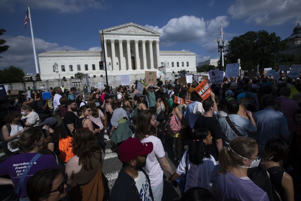 Abortion demonstrators are seen near the Supreme Court in Washington June 24 as the court overruled the landmark Roe v. Wade abortion decision in its ruling in the Dobbs case on a Mississippi law banning most abortions after 15 weeks. (CNS/Tyler Orsburn)