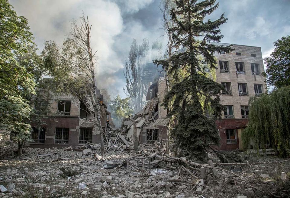 Smoke rises from a destroyed building after A Russian military airstrike in Lysychansk, Ukraine, June 17. (CNS/Reuters/Oleksandr Ratushniak)