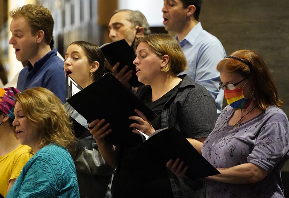 Choir members sing during a Mass at St. Paul the Apostle Church June 25 in New York City for participants of the Outreach LGBTQ Catholic Ministry Conference. (CNS/Gregory A. Shemitz)