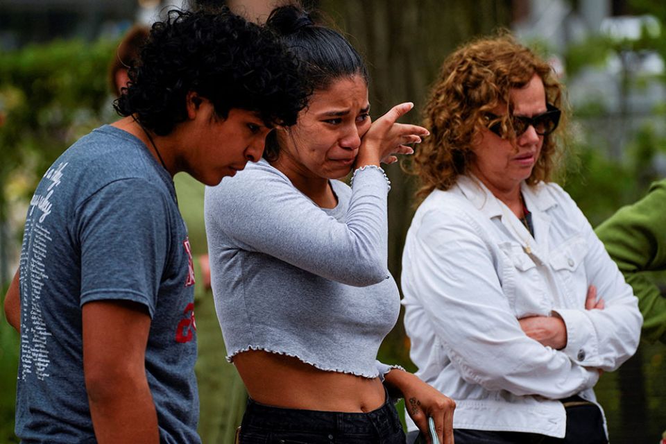 Jazel Ramos, niece of victim Eduardo Uvalde, cries while visiting a memorial site July 6 in Highland Park, Illinois, after a mass shooting at a Fourth of July parade. (CNS/Reuters/Cheney Orr)