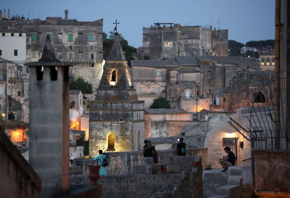 People enjoy the evening in Matera, Italy, June 29, 2021. Pope Francis will visit the southern Italian city Sept. 25 to celebrate the closing Mass of the Italian National Eucharistic Congress. (CNS/Reuters/Yara Nardi)