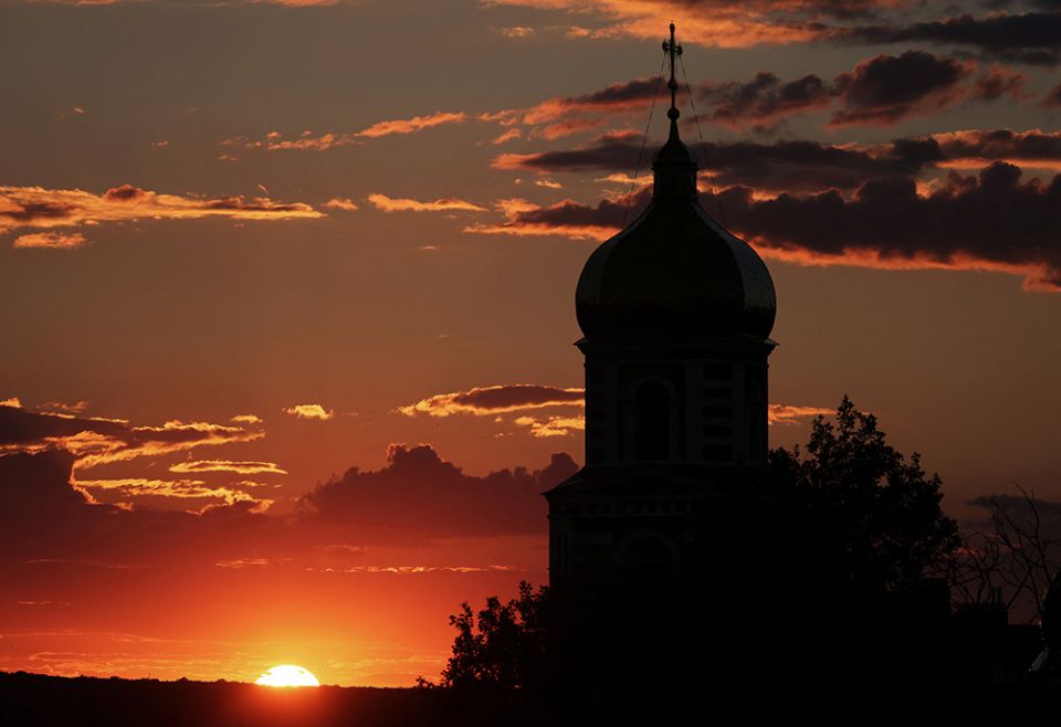 A church is seen at sunset July 12 in Kharkiv, Ukraine, during the Russian invasion. (CNS/Reuters/Nacho Doce)