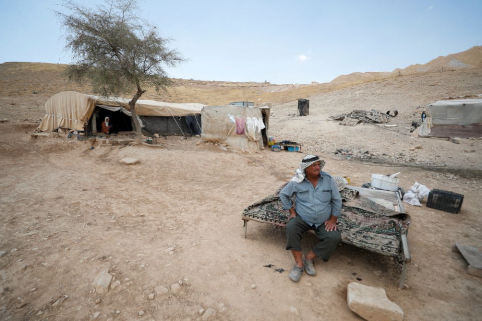 A Palestinian Bedouin sits near his tent near Jericho in the Israeli-occupied West Bank June 27, 2022. (CNS photo/Mohamad Torokman, Reuters)
