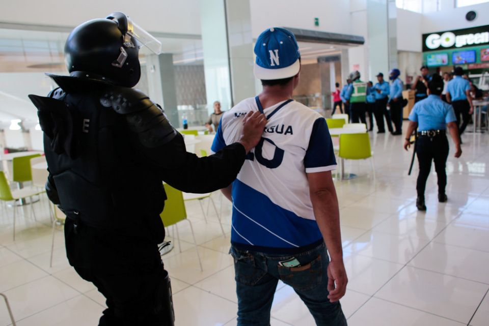 A protester is picture in a file photo being detained during a demonstration against Nicaraguan President Daniel Ortega's government in Managua. 