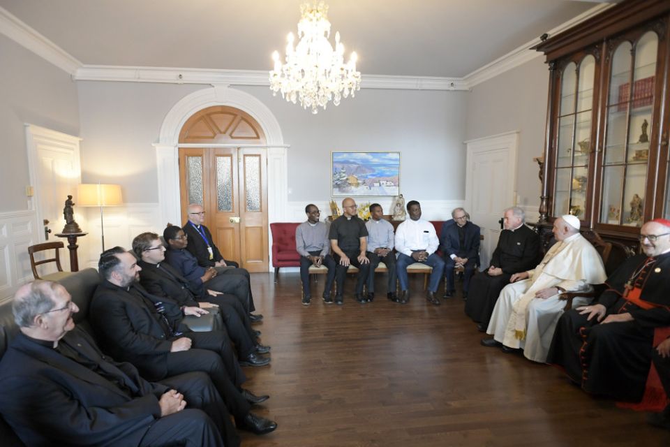 Pope Francis meets with Jesuits working in Canada during a meeting at the archbishop's residence in Quebec July 29, 2022. At right is Cardinal Michael Czerny, prefect of the Dicastery for Promoting Integral Human Development.