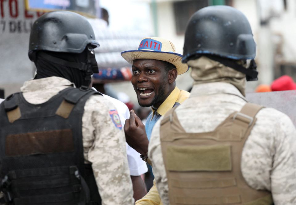 A demonstrator shouts at police during protests demanding that the government of Haitian Prime Minister Ariel Henry do more to address gang violence, including constant kidnappings, in Port-au-Prince March 29. (CNS/Reuters/Ralph Tedy Erol)