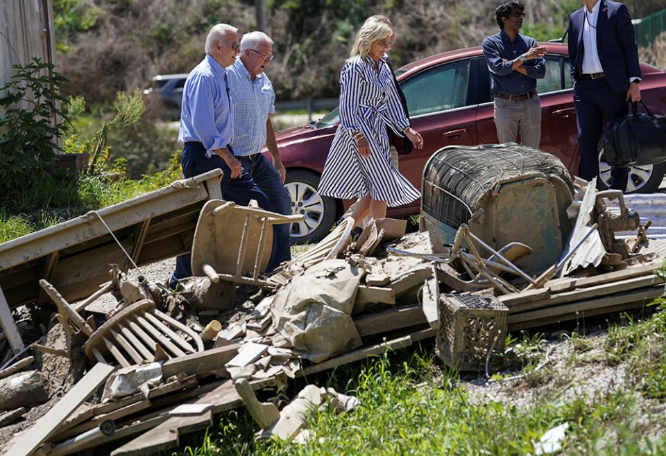 President Joe Biden and first lady Jill Biden walk past debris while viewing flood damage and response efforts Aug. 8 in Lost Creek, Kentucky. (CNS/Reuters/Kevin Lamarque) President Joe Biden and first lady Jill Biden walk past debris while viewing flood damage and response efforts Aug. 8 in Lost Creek, Kentucky. (CNS/Reuters/Kevin Lamarque)