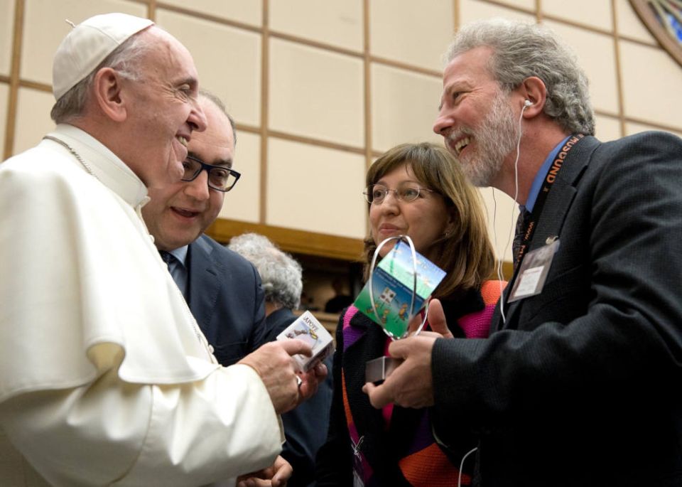 John Mundell, right, meets with Pope Francis at the Vatican in 2017. Also in the photo are Luigino Bruni, an Italian economist and Eva Gullo, an entrepreneur. (CNS photo/courtesy John Mundell via The Criterion)
