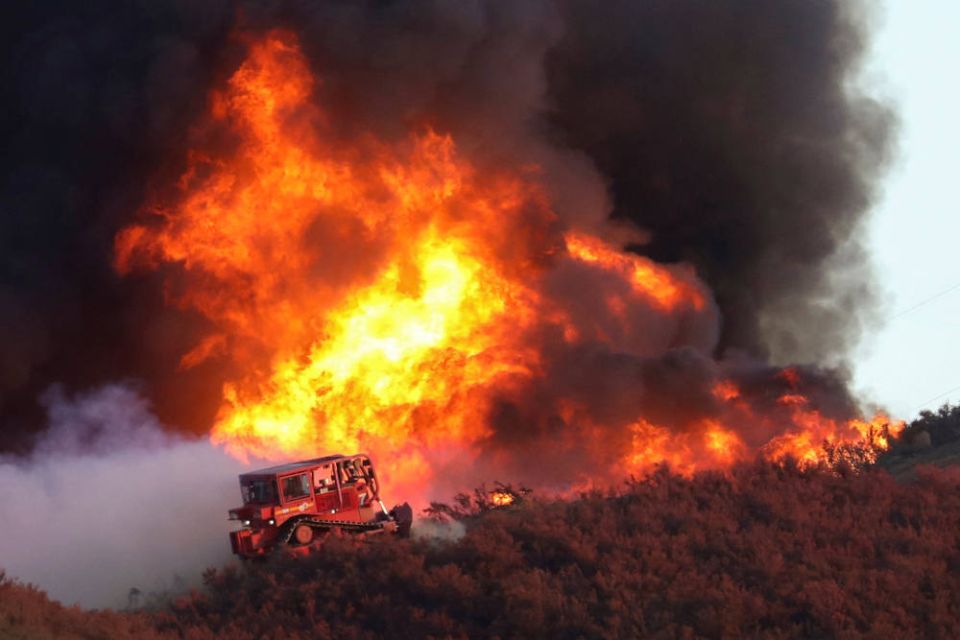 A bulldozer is at the edge of the Route Fire burning near Castaic, Calif., Aug. 31, 2022. (CNS photo/David Swanson, Reuters)
