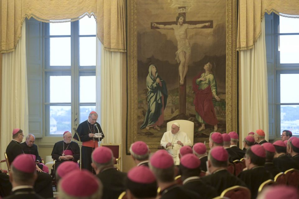 Pope Francis listens as Cardinal Pietro Parolin, Vatican secretary of state, speaks during a meeting with papal nuncios from around the world at the Vatican Sept. 8, 2022. 