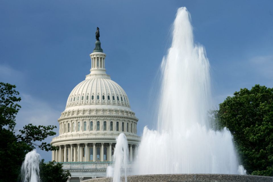 The dome of the U.S. Capitol in Washington is seen beyond a fountain Aug. 12. (CNS/Reuters/Kevin Lamarque)