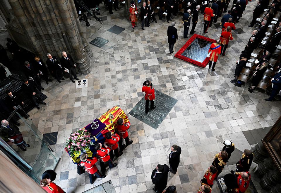 Pallbearers carry the casket of Queen Elizabeth II with the imperial state crown resting on top into Westminster Abbey during her state funeral Sept. 19 in London. (CNS/Gareth Cattermole, pool via Reuters) Pallbearers carry the casket of Queen Elizabeth II with the imperial state crown resting on top into Westminster Abbey during her state funeral Sept. 19 in London. (CNS/Gareth Cattermole, pool via Reuters)