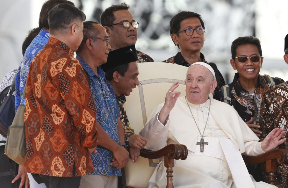 Pope Francis meets Jesuit priests from Indonesia during his general audience in St. Peter's Square at the Vatican Sept. 21, 2022.