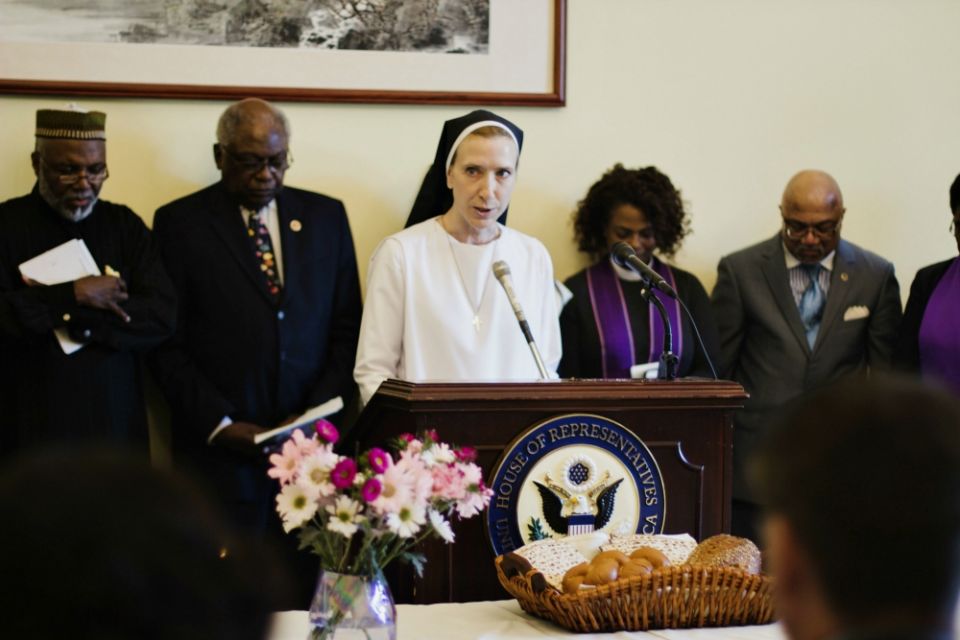 Dominican Sr. Quincy Howard, Network's government relations fellow, offers the closing prayer at the interfaith service May 8 in the Cannon House Office Building in Washington, D.C. (NETWORK Lobby for Catholic Social Justice/Mehreen Karim)