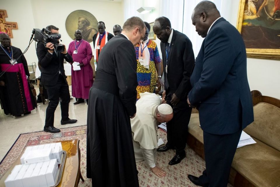Pope Francis kneels at the feet of South Sudan President Salva Kiir at the conclusion of a two-day retreat at the Vatican for the African nation's political leaders, in this April 11, 2019, file photo. The pope plans to visit South Sudan July 5-7. 