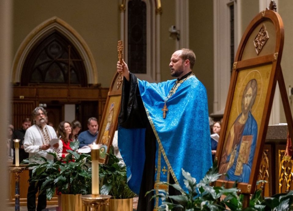 Jesuit Fr. Andrij Hlabse, a theology doctoral candidate at the University of Notre Dame and a Ukrainian Byzantine Catholic priest, presides at the prayer vigil for peace in Ukraine at the Basilica of the Sacred Heart. (CNS/University of Notre Dame)