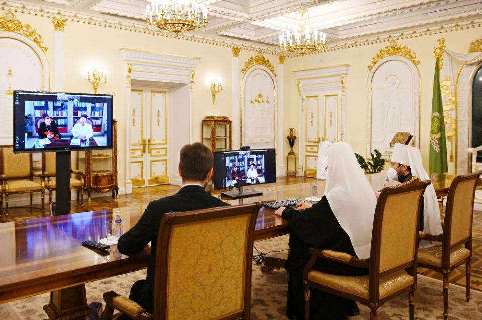 Russian Orthodox Patriarch Kirill of Moscow and Metropolitan Hilarion of Volokolamsk, head of external relations for the Russian Orthodox Church, participate in a video meeting with Pope Francis and Swiss Cardinal Kurt Koch March 16.