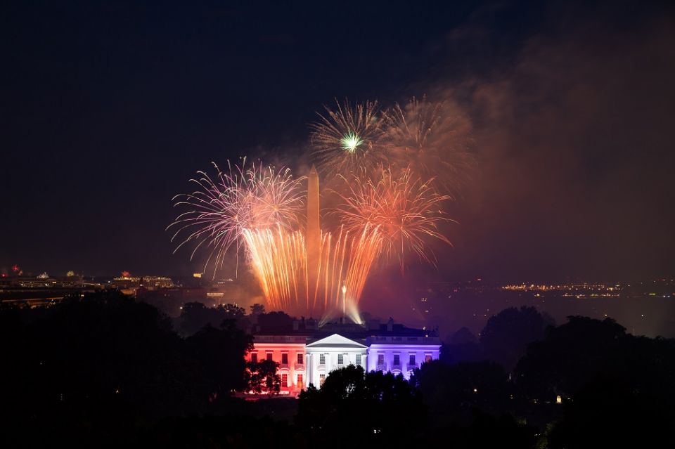 Fireworks appear above the White House North Portico, lit in red, white and blue lights, July 4, 2020, during the Salute to America Fourth of July celebration. (Official White House photo/Keegan Barber)