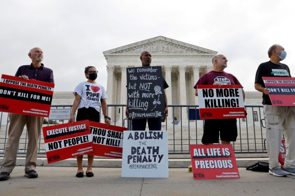 Death penalty protesters are seen outside the U.S. Supreme Court building in Washington Oct. 13, 2021. With Roe v. Wade overturned, the president of the Pontifical Academy for Life, urges Catholics to continue fighting to protect life in all its forms.