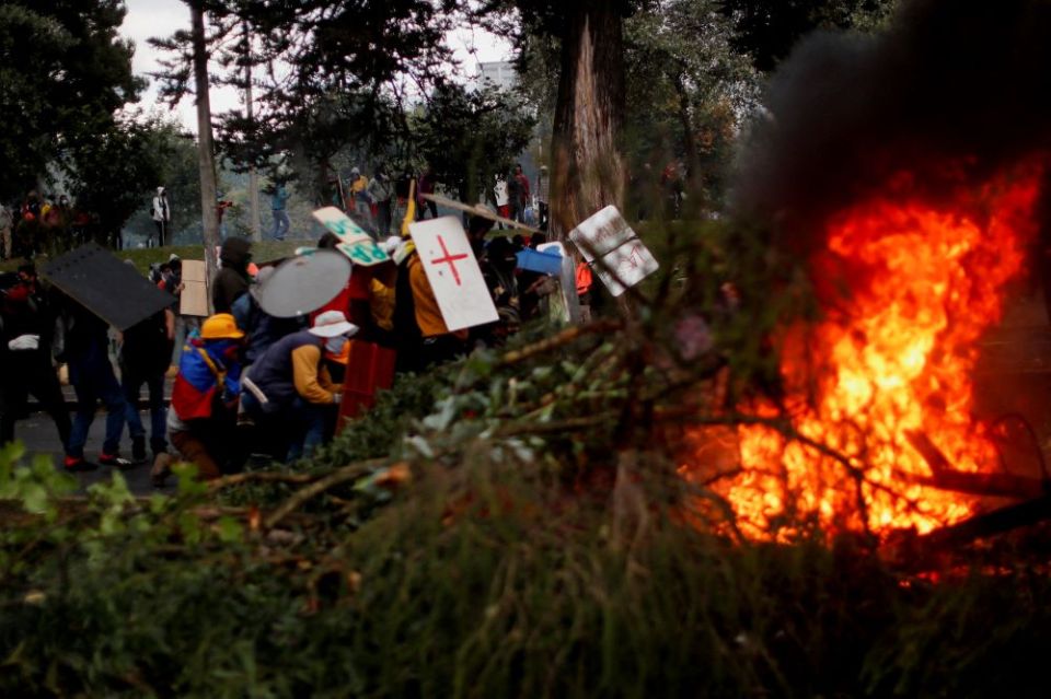 Demonstrators in Quito, Ecuador, use makeshift shields during an anti-government protest June 23 amid a stalemate between the government of President Guillermo Lasso and largely Indigenous demonstrators. 