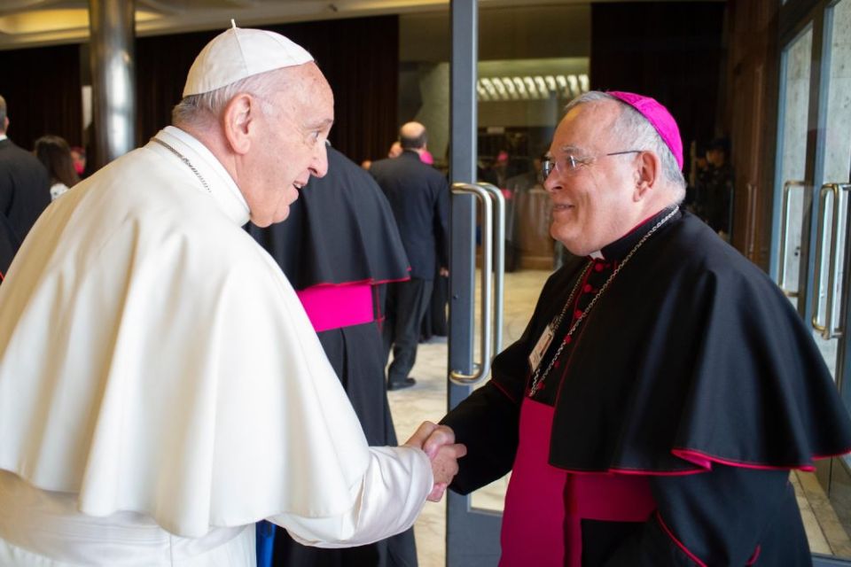 Pope Francis greets Archbishop Charles J. Chaput of Philadelphia before a session of the Synod of Bishops on young people, the faith and vocational discernment at the Vatican Oct. 16, 2018. (CNS/Vatican Media)