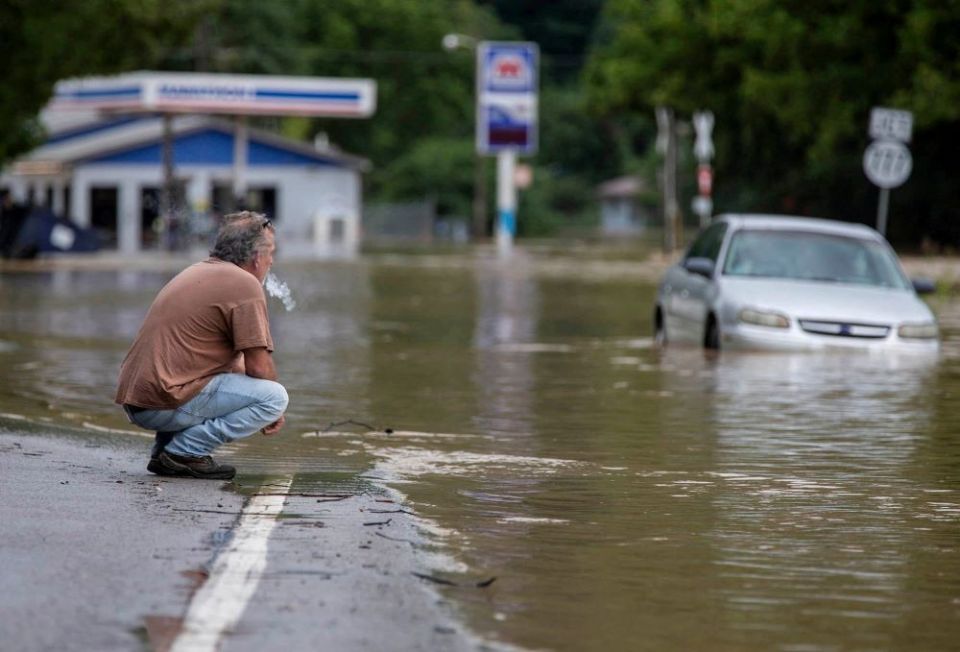 Van Jackson is seen by floodwaters along Right Beaver Creek July 28 after a day of heavy rain in in Garrett, Kentucky. (CNS/USA TODAY NETWORK via Reuters/Pat McDonogh)