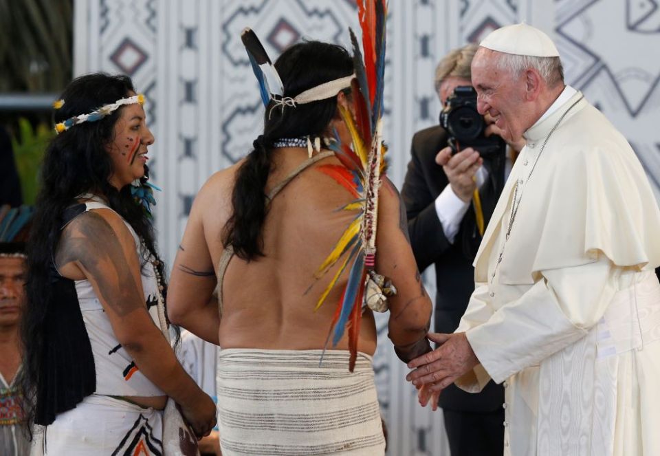 Pope Francis greets people of the Amazon in Puerto Maldonado, Peru, Jan. 19, 2018. Francis asked his audience to hold fast to their traditional practices and to teach the bishops and other church workers. (CNS/Paul Haring)