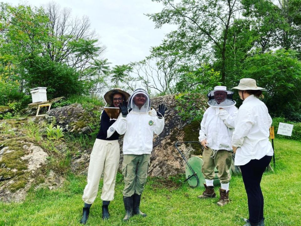 Mercy Ecospirituality Center volunteers this summer helped re-hive two swarms of bees. They also worked with the staff to harvest honey. (Kayla Buxton)