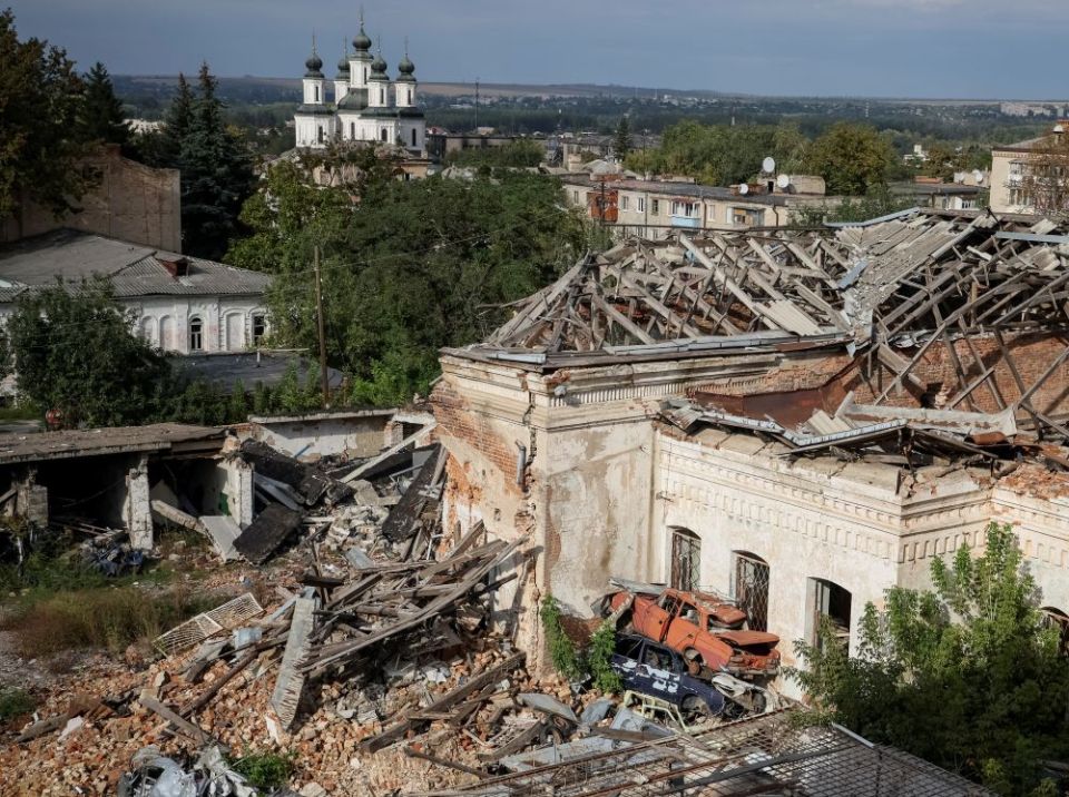 Destroyed houses and cars are seen in Izium, recently liberated by Ukrainian Armed Forces, in the Kharkiv region of Ukraine, Sept. 20. (CNS/Reuters/Gleb Garanich)